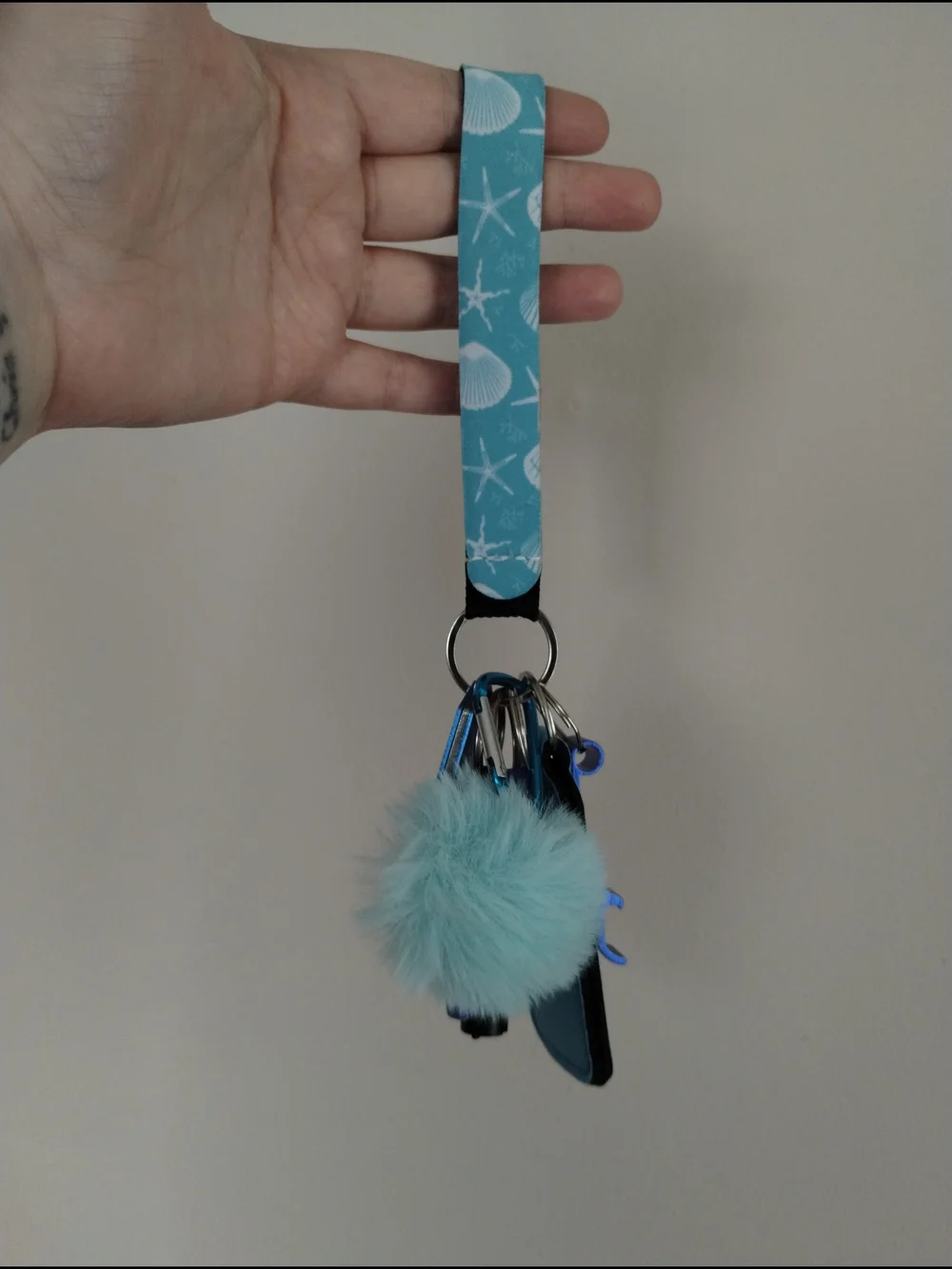 Sea Shell Print Wristlet Keychain with Aqua Faux Fur Pom